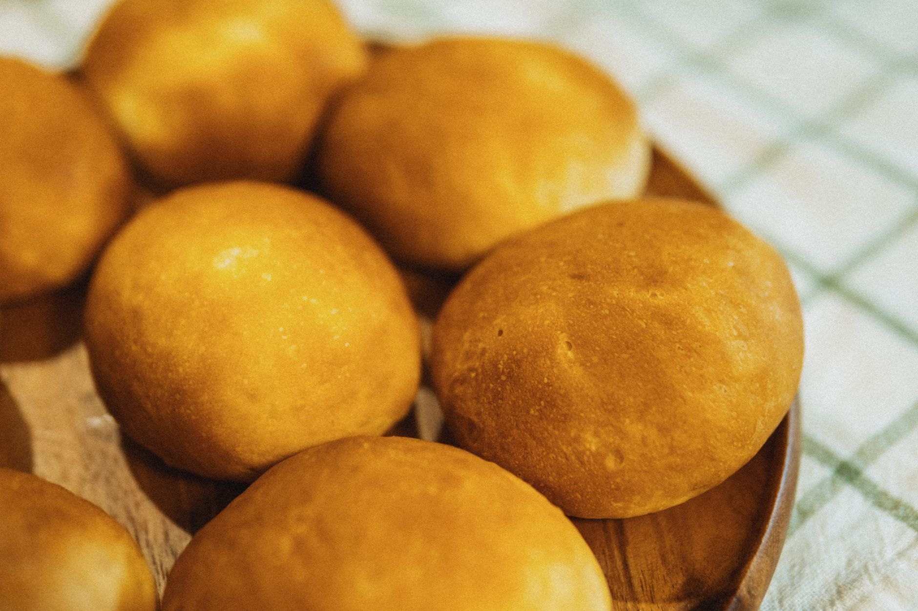 Golden freshly baked bread rolls on display for Instagram audience