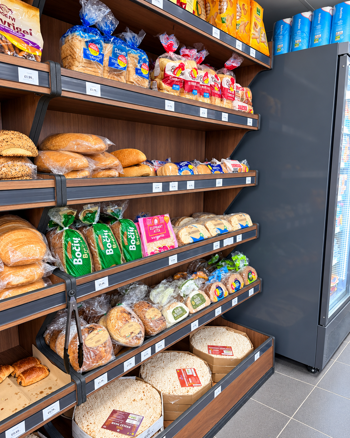 Bread loaves, rolls and flatbreads on Nova Food Centre shelves