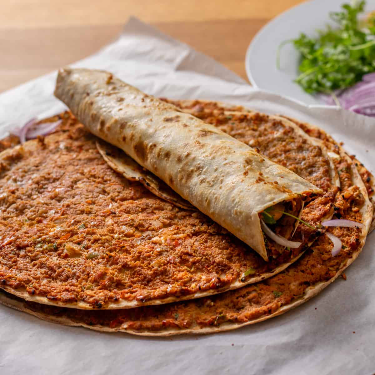 Freshly made lahmacun with toppings