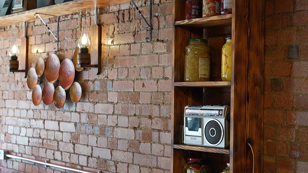 Traditional Turkish wood-fired oven glowing with warmth in a restaurant kitchen