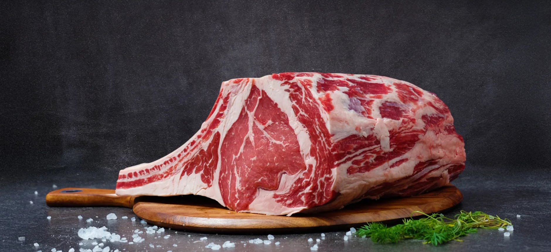 Skilled butcher carefully preparing premium meat cuts in the shop