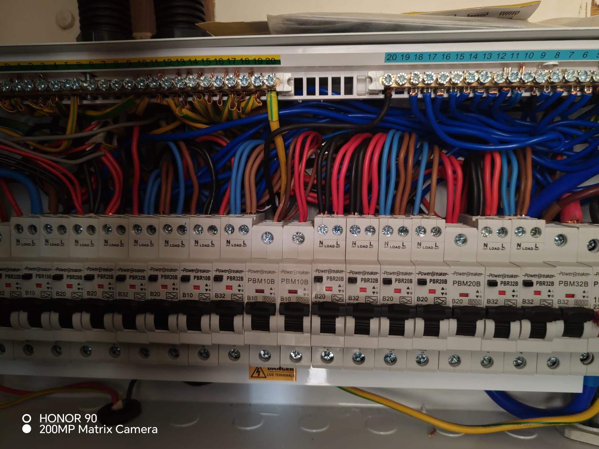 Specialist electrician using multimeter to test voltage in residential socket